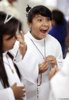 Blissful moment at her first Catholic communion.