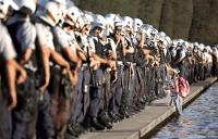 Lone protester confronts Police in front of the Congress in Brazil.