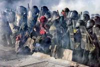 Police repel protesters at the Summit of the Americas in Canada.