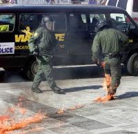 Policeman hit by molotov cocktail; Summit of the Americas in Canada.