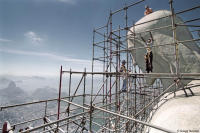 Breathtaking view of workers atop the statue of Christ at Corcovado Mountain in Rio.