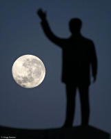 Setting moon and JK memorial in Brasília.