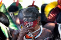 Indigenous man smoking a cigarette in Brazil.
