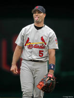 1B Albert Pujols jokes with an umpire.