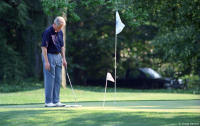 On the White House putting green before a summer outing.