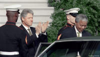 Applauding Nelson Mandela as he departs the White House.