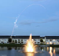 The arc of a Delta IV rocket as it streaks toward space.