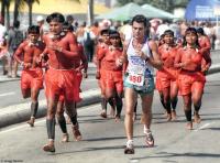 Indigenous people join a 5K run along Copacabana Beach in Rio.