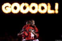 The scoreboard says it all as Flamengo players celebrate.