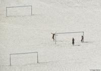 Young men practice on Copacabana Beach in Rio.