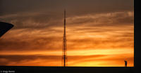 Washer completes his tasks at dusk atop the National Congress in Brasília.