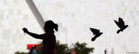Photo-bombers; a tourist snaps a self-portrait at Three Powers Square in Brasília.