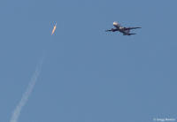 Aerial serendipity; a passenger jet flying past a SpaceX Falcon 9 rocket.